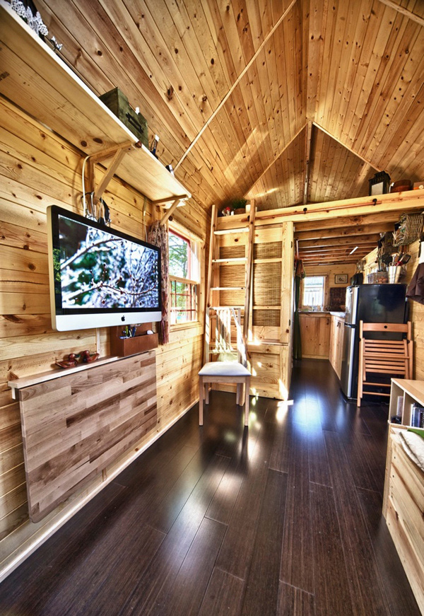 other side of the house where you can see the sleeping loft on a shed 