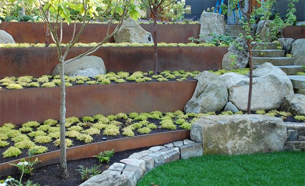 erosion prevent retaining landscape walls ambleside concave wood steel soil slope yard pressure boulders behind place plates