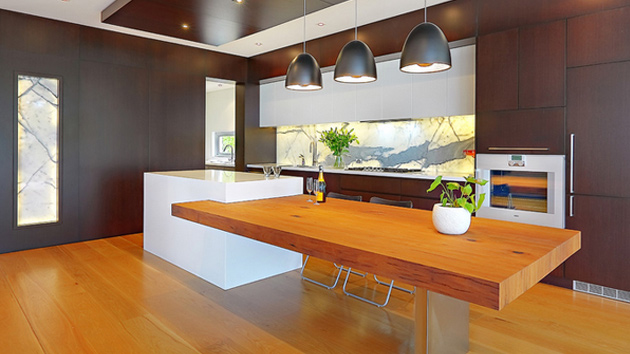 kitchen island with a table attached to it