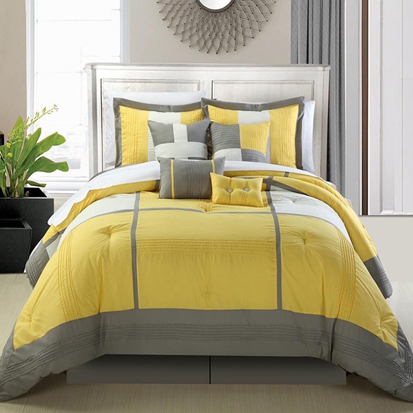 gray and yellow bed cover