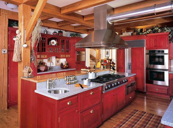 Cream-colored kitchen with one red wall