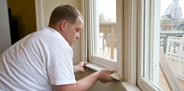 Install window insulators and door stripping