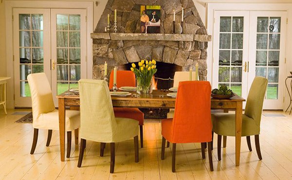 kitchen table with different colored chairs