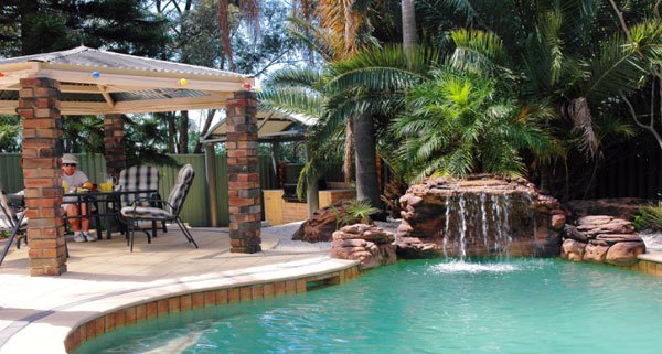 15 pool waterfalls ideas for your outdoor space home