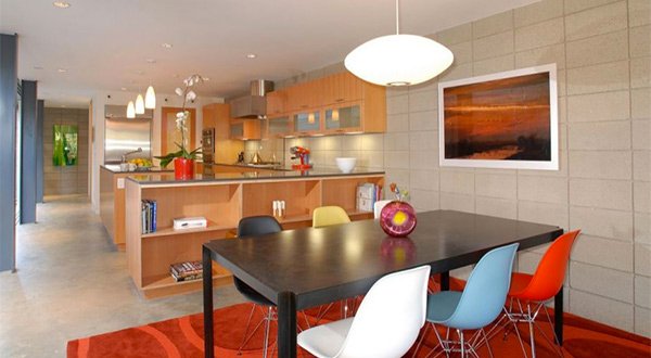 glass table with multi colored chairs