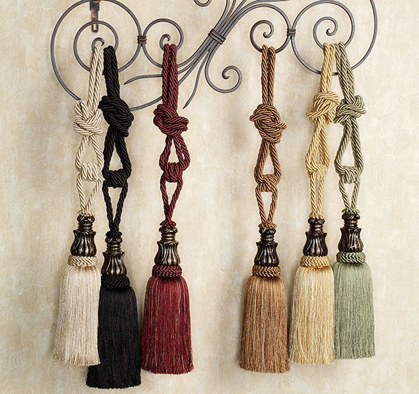 A pair of bespoke twisted cord curtain tie-backs with tassels 