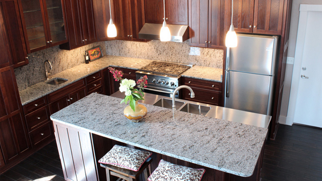 grey granite countertops with brown cabinets