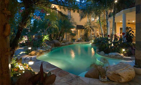 15 Relaxing and Dramatic Tropical Pool Designs | Home Design Lover