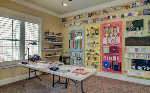 Craft Room Layouts : Copy This Craft & Sewing Room Makeover! - Postbox Designs / This craft room makes use of every inch of its cellar space.