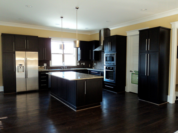 light grey kitchen cabinet dark floor dark island