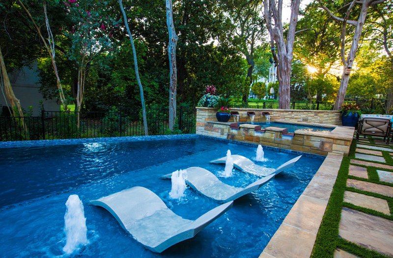 swimming pool with lounge chairs