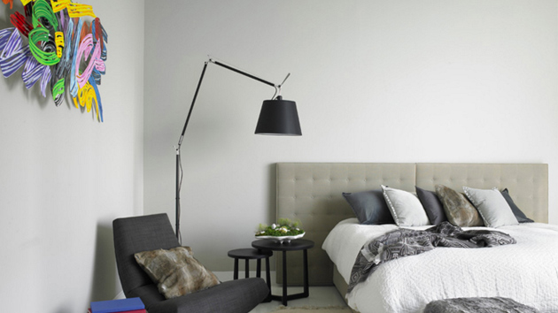 floor lamp beside bed