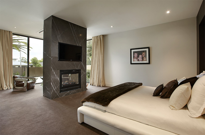 modern mansion master bedroom with tv