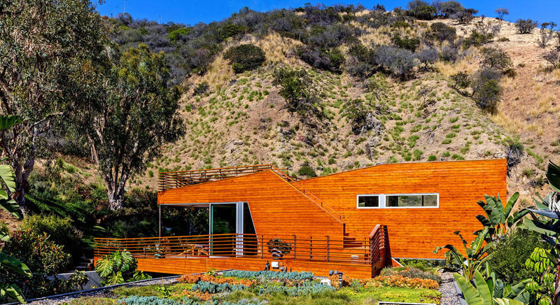 wood clad home green roof