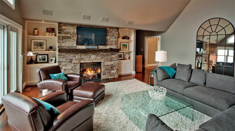 gray living room with brown leather furniture