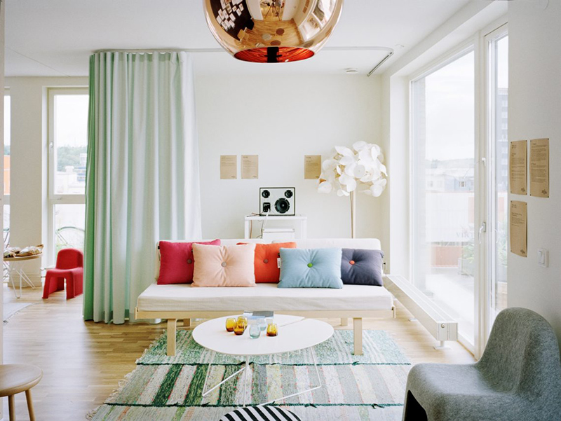 Living Room Pastel Colors - 10 Tips for Incorporating Spring Pastels Into Your Home - The color palette of this living room keeps everything light and bright but a few key black accents were added to bring contrast and to highlight design features.